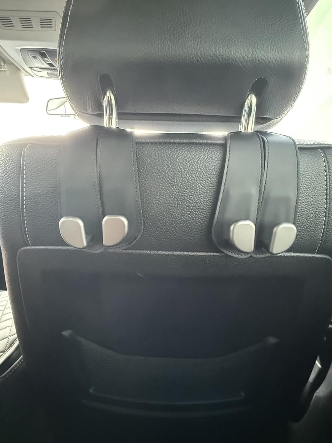 Customer photo review of BOLTHUT™ Leather Car Headrest Hooks — Back-Seat Bag Hangers