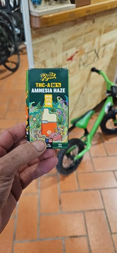 Customer's Rollz THC-A vape Amnesia Haze packaging held in a person's hand