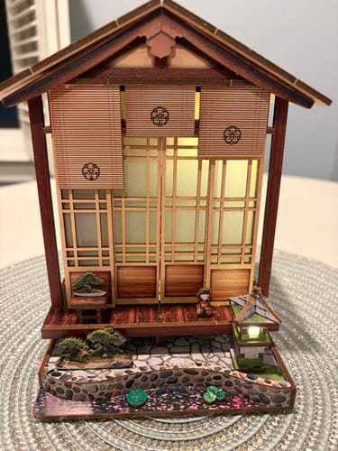 Customer's completed Lantern House DIY kit featuring wood structures, shoji screens, and a miniature stone garden.