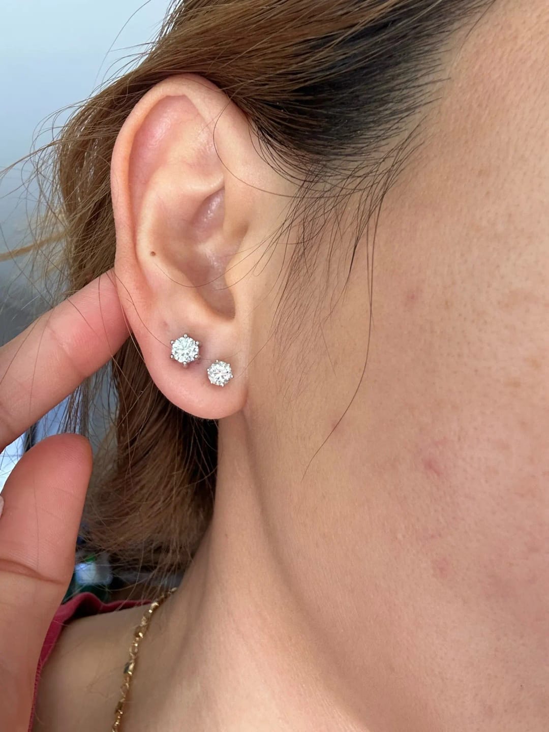 Customer photo review of STERLING SILVER STUD EARRINGS WITH MOISSANITE