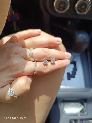 Customer photo review of STERLING SILVER STUD EARRINGS WITH MOISSANITE