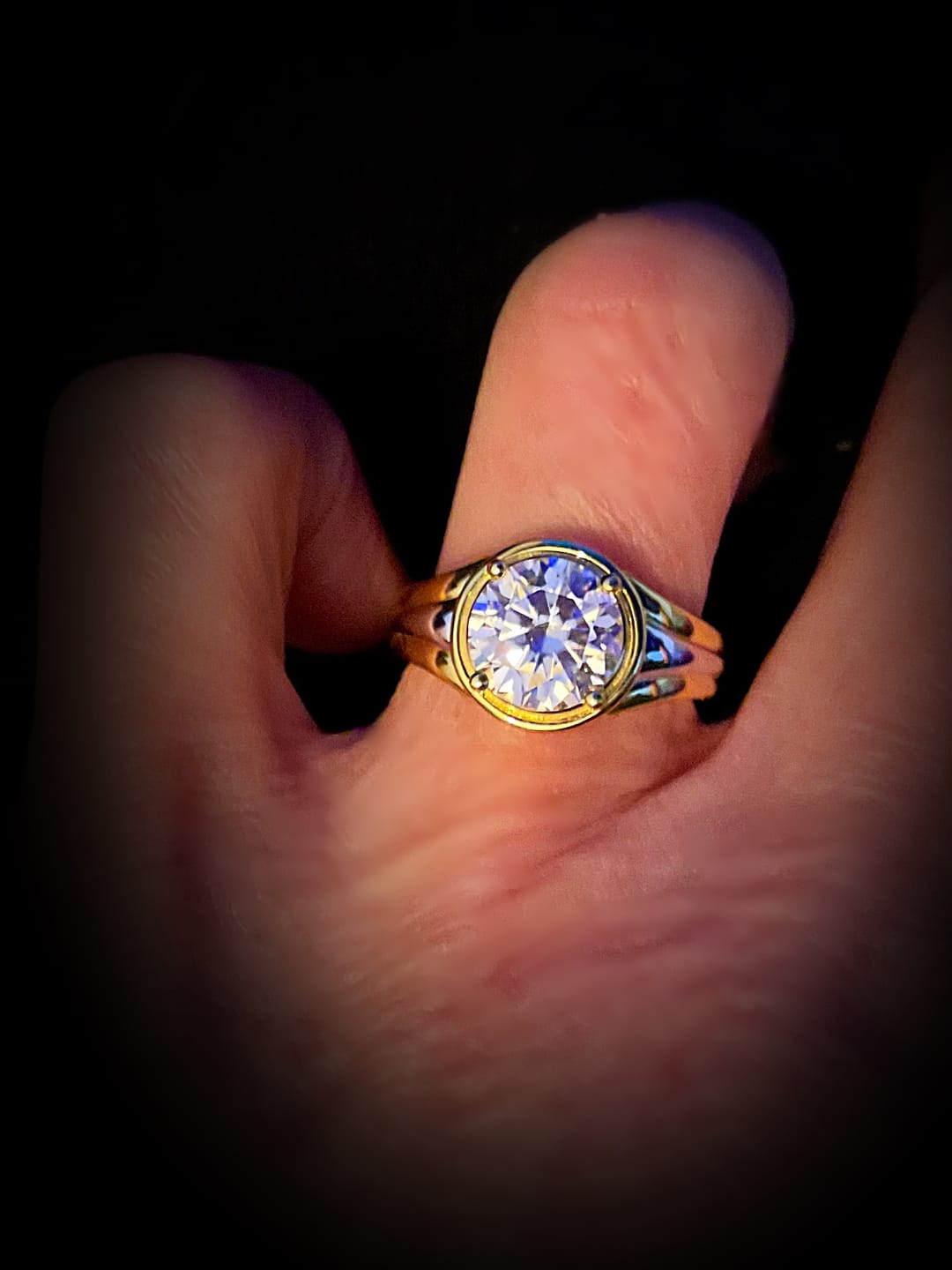 Customer photo review of Solitaire Round Moissanite Streamlined Two-Tone Engagement Ring