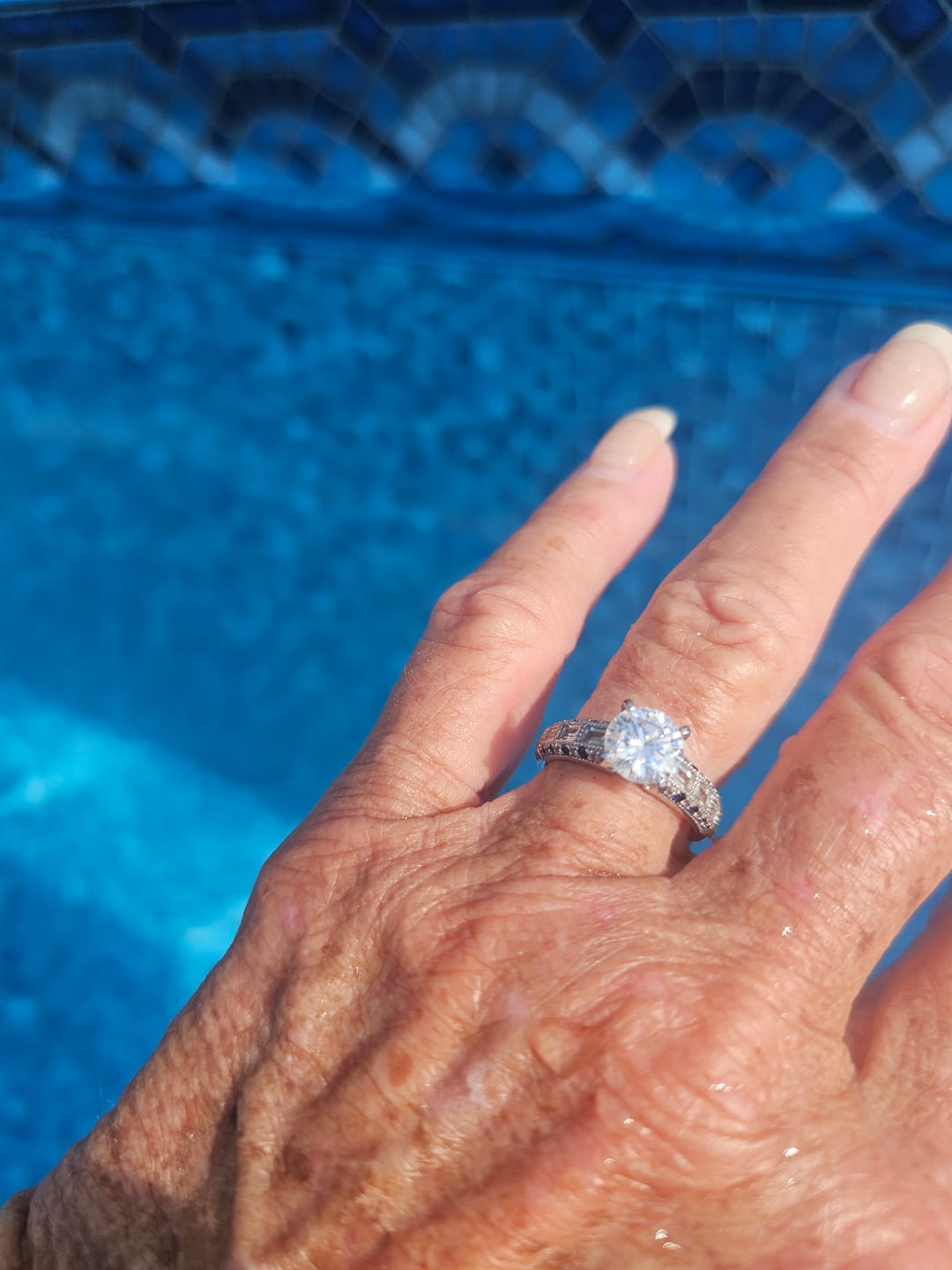Customer photo review of Vintage Moissanite With Tapered Baguette Sapphire Milgrain Engagement Ring