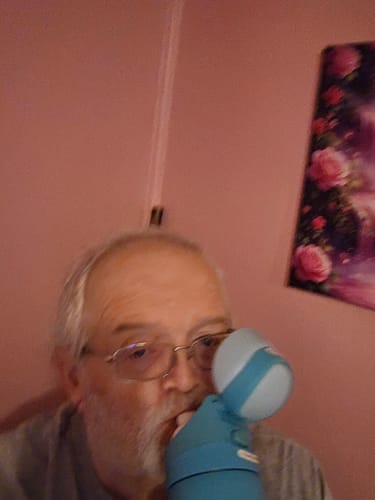 Customer's GoSip Strawberry Dream bottle, held close while sipping