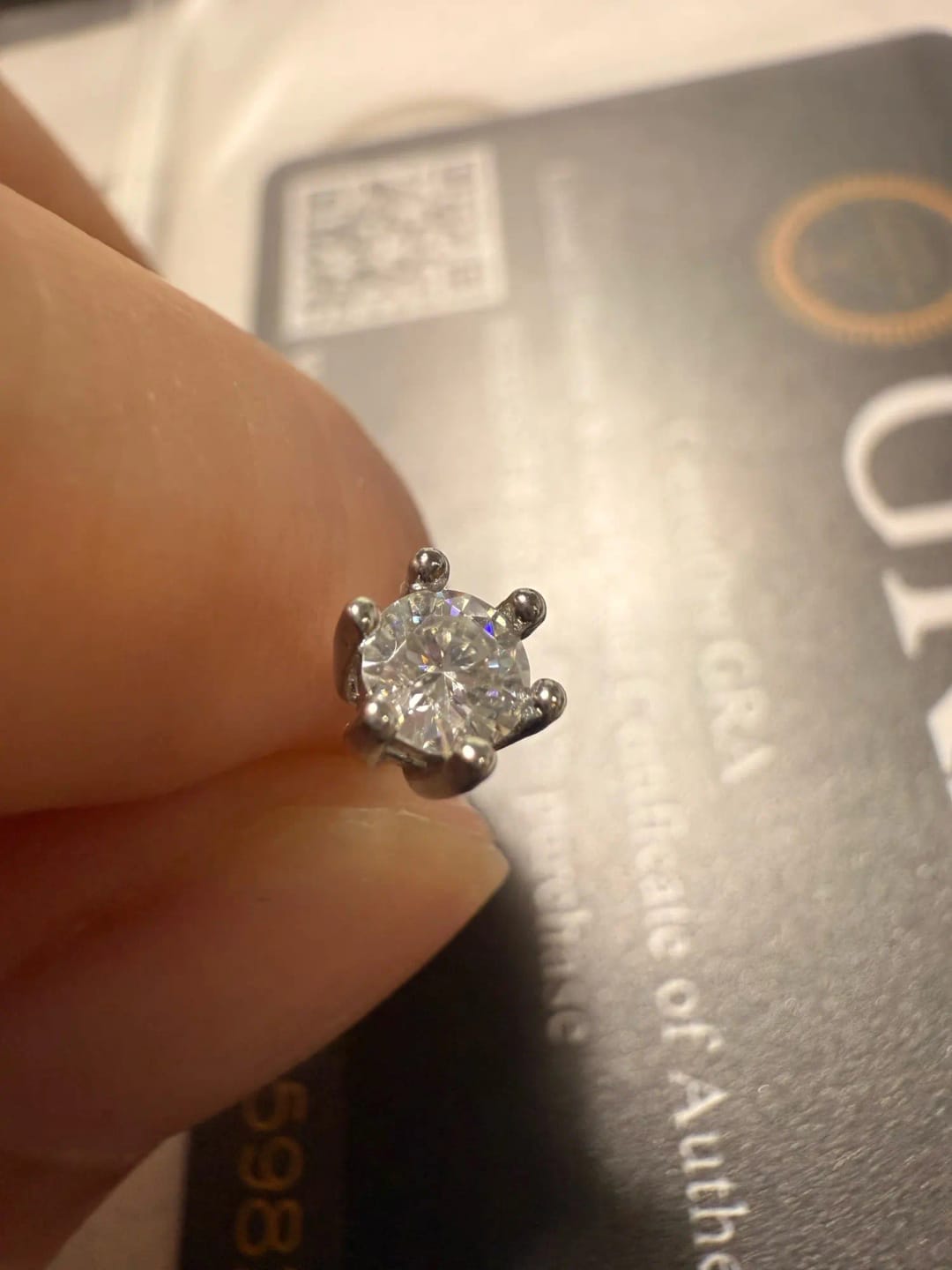 Customer photo review of STERLING SILVER STUD EARRINGS WITH MOISSANITE