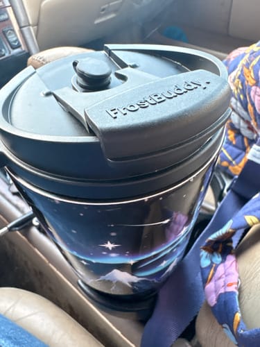 Customer's To-Go Buddy cup with dark night sky design sitting in a car cup holder.