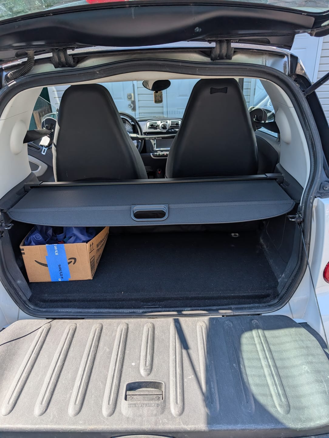 Customer photo review of 2008-2015 Smart Fortwo OE Style Black Cargo Cover Vinly Aluminum Rod