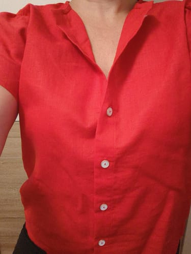 Customer's Sacha blouse in poppy red linen, showcasing the buttoned front design.