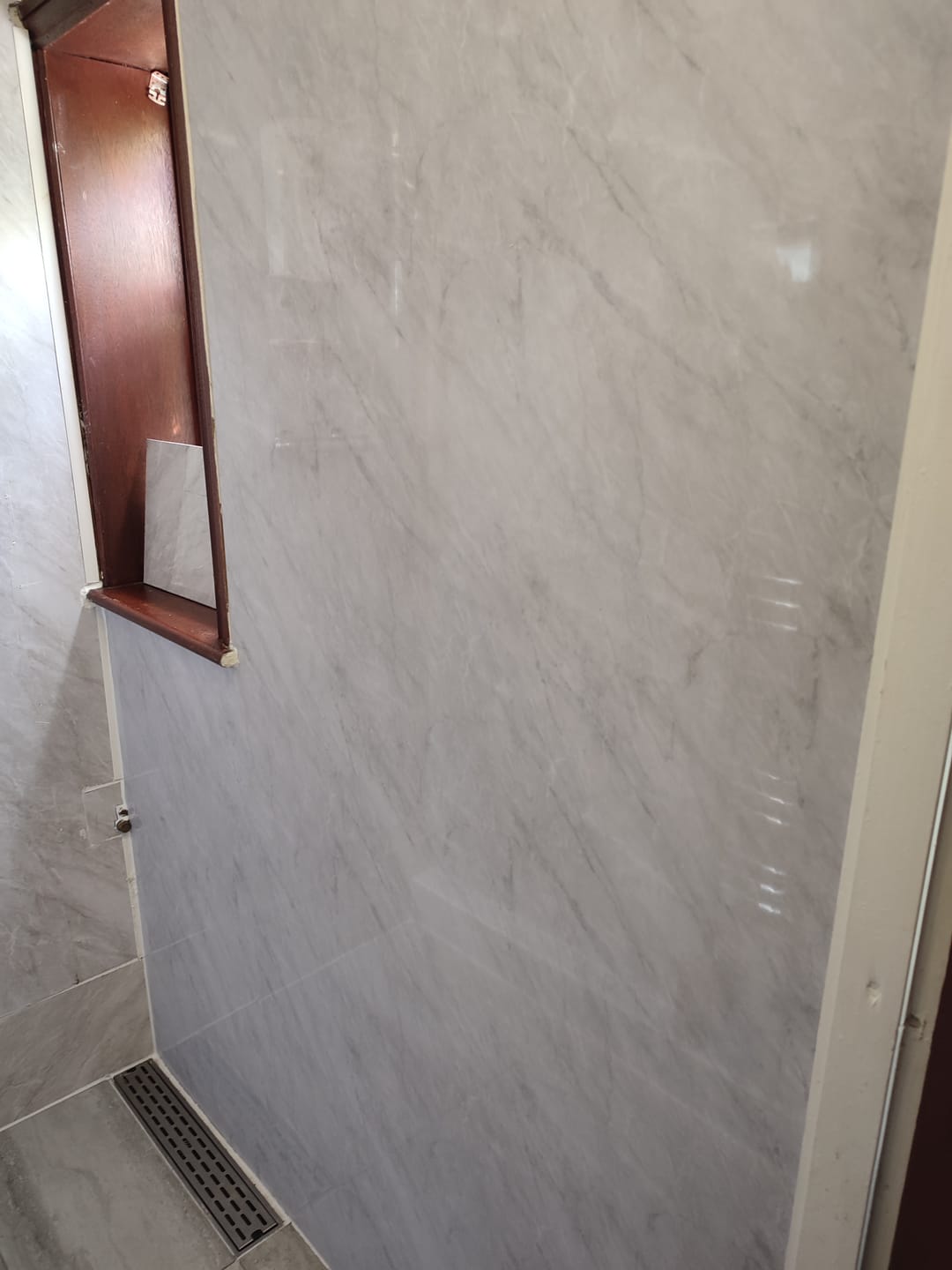 Customer photo review of Premium Grey Marble Gloss Shower Wall Panel – 1M x 2.4M