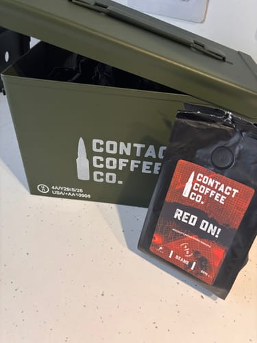 Customer's Coffee Resupply with a bag of Red On coffee resting against an open military green steel ammo tin.