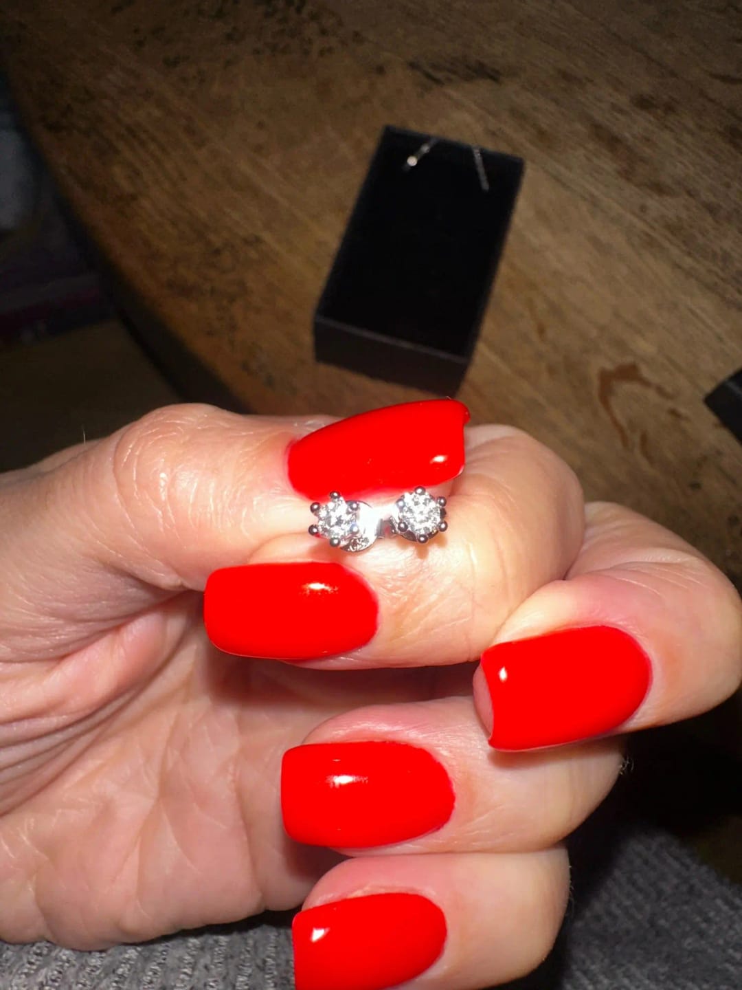 Customer photo review of STERLING SILVER STUD EARRINGS WITH MOISSANITE