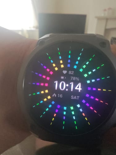 Customer's Gard Pro Ultra 3 watch on a wrist, showing a vibrant, colorful digital display with the time and battery life.