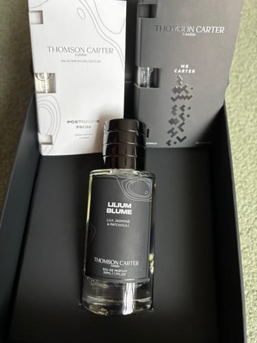 Customer's Lilium Blume Eau de Parfum bottle, two sample vials, and black product box.