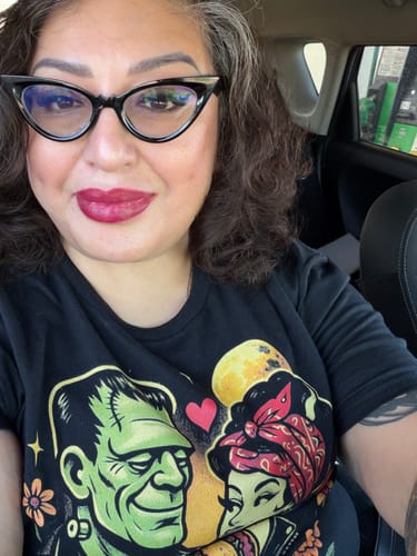Customer's black True Love Franky & Liz Taco T-Shirt featuring a cartoon Frankenstein and bride eating tacos.