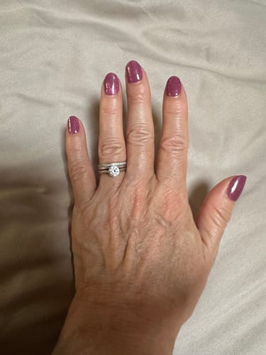 Customer's hand showing smooth, mauve-colored salon-quality nails achieved with the Holy Gels Starter Kit.