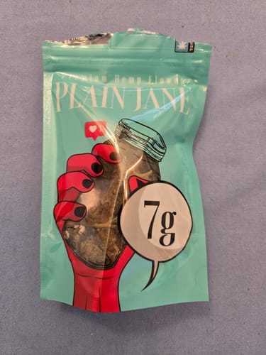 Customer's resealable light blue pouch of Lemon Cookie Dough CBD Flower with a graphic of a hand holding a jar.