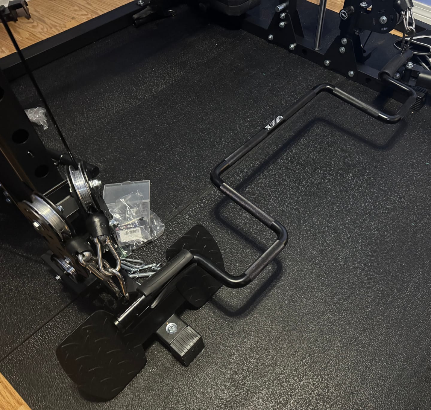 Customer photo review of - THE ANDREONI BAR ™ - A revolutionary and versatile cable machine attachment that replaces multiple bulky expensive gym machines.