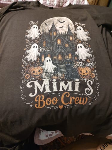 Customer's brown Grandma's Boo Crew haunted house shirt with ghosts, pumpkins, and a cat printed on the front.