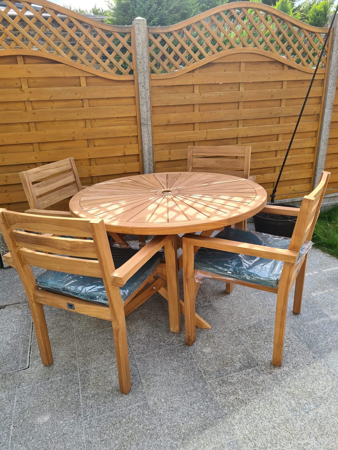 Customer photo review of Teak Garden Furniture Set 120cm Round Sunshine Table 4 x Oxford Stacking Chairs Cushions Included