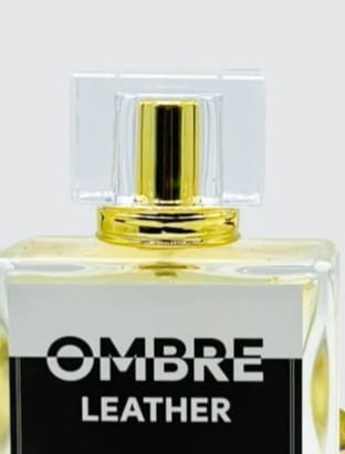 Customer's Ombre Leather perfume bottle showing the clear glass, gold cap, and black and white label.