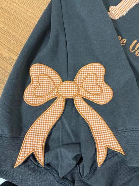 Customer photo review of Custom Tennessee Volunteers Women’s Team Spirit Sweatshirt – Applique Embroidered Side Bow Pullover