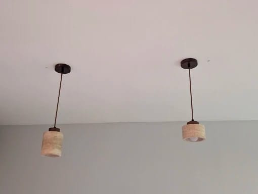 Customer photo review of Stone Pendant Light With Textured Shade And Wooden Accent 12 Inch