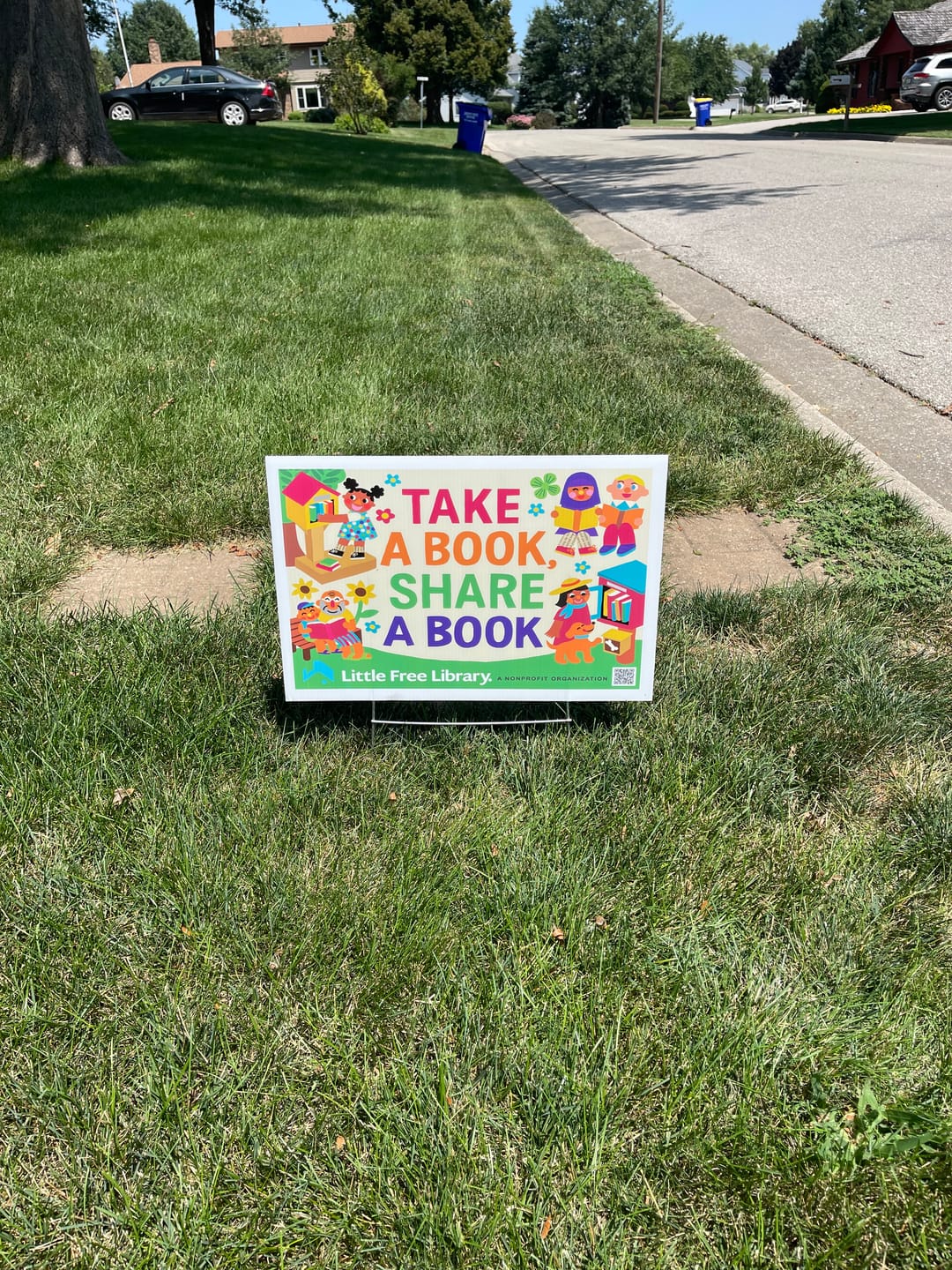 Customer photo review of Take a Book Share a Book Yard Sign