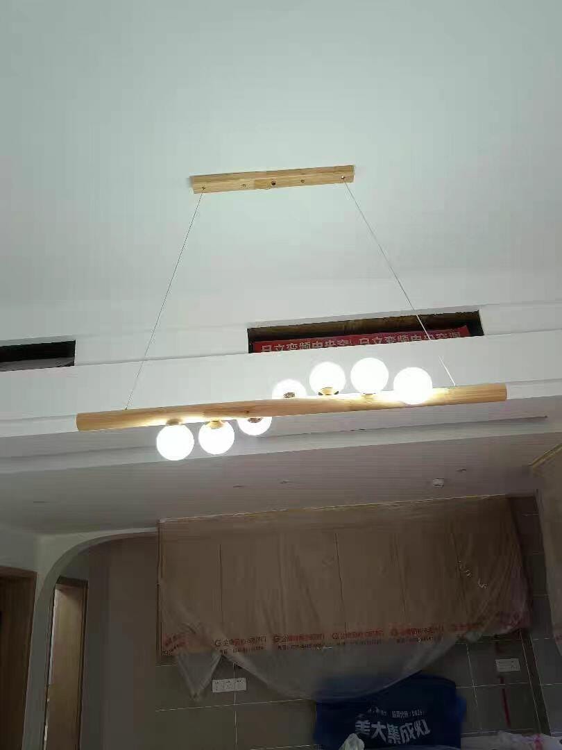 Customer photo review of Linear Wood Pendant Light, Walnut Bar, Opal Glass Globes, G9