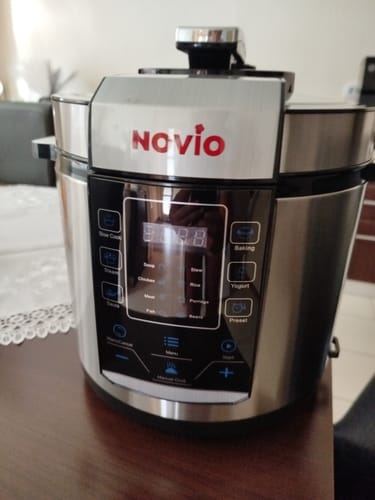 Customer's silver Novio SteelCook multicooker with a digital touch panel on a kitchen counter.