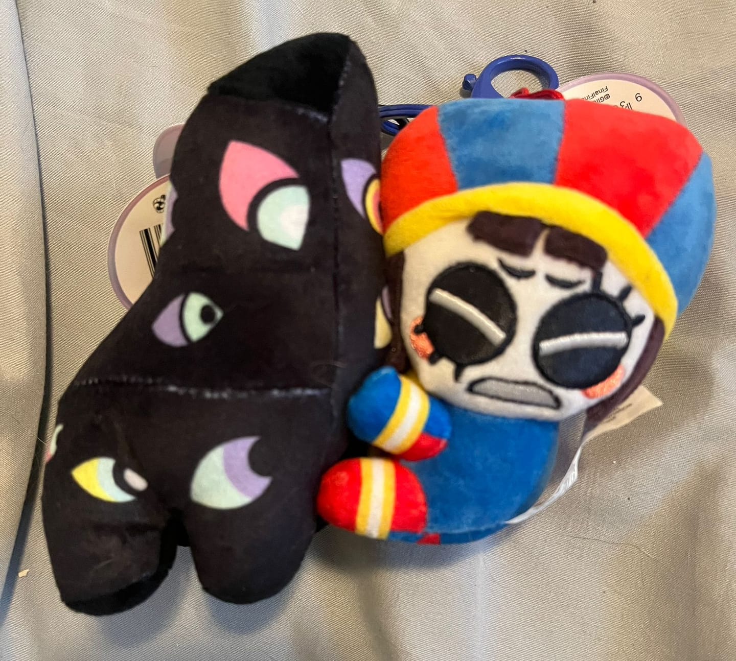 Customer photo review of Pomni & Abstraction Magnetic Plush Keychains