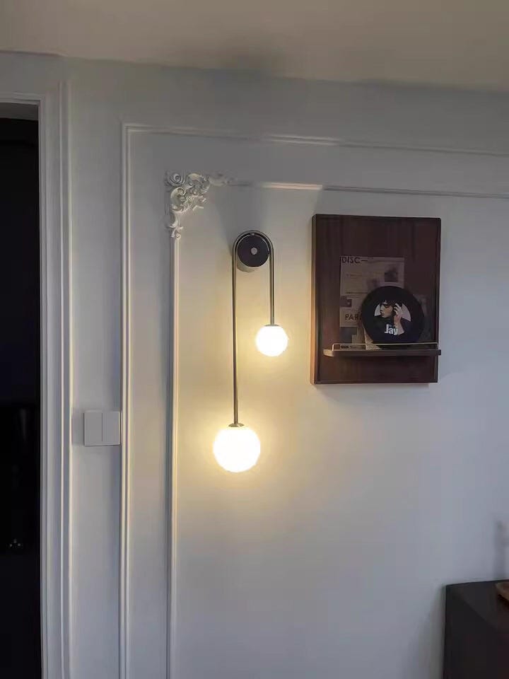 Customer photo review of Brass Arc Wall Light, Curved Arm, Two White Glass Shades, G9