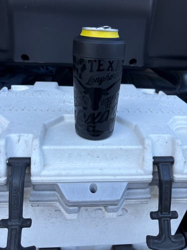 Customer's black Texas Longhorns Universal Buddy can cooler sitting on top of a white cooler.