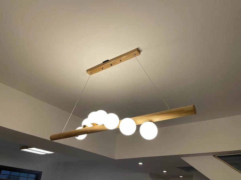 Customer photo review of Linear Wood Pendant Light, Walnut Bar, Opal Glass Globes, G9