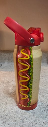 Customer's Bottle Buddy 24oz Big Dawg featuring a hot dog graphic, standing on a kitchen counter.