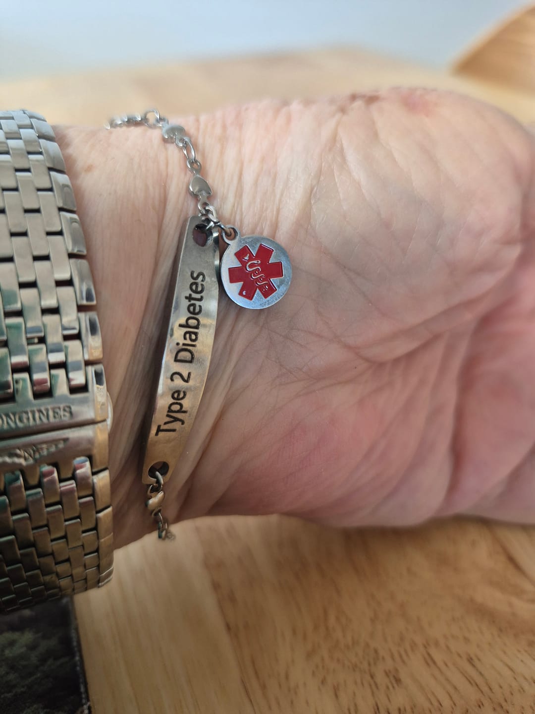 Customer photo review of Personalised Medical Alert Heart Link Bracelet