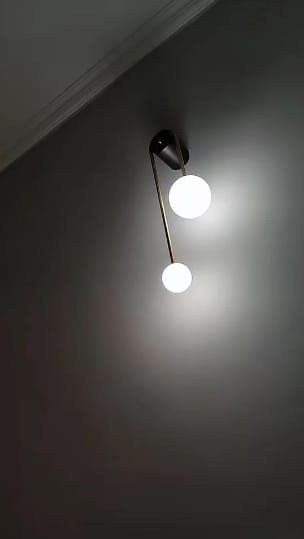 Customer photo review of Brass Arc Wall Light, Curved Arm, Two White Glass Shades, G9