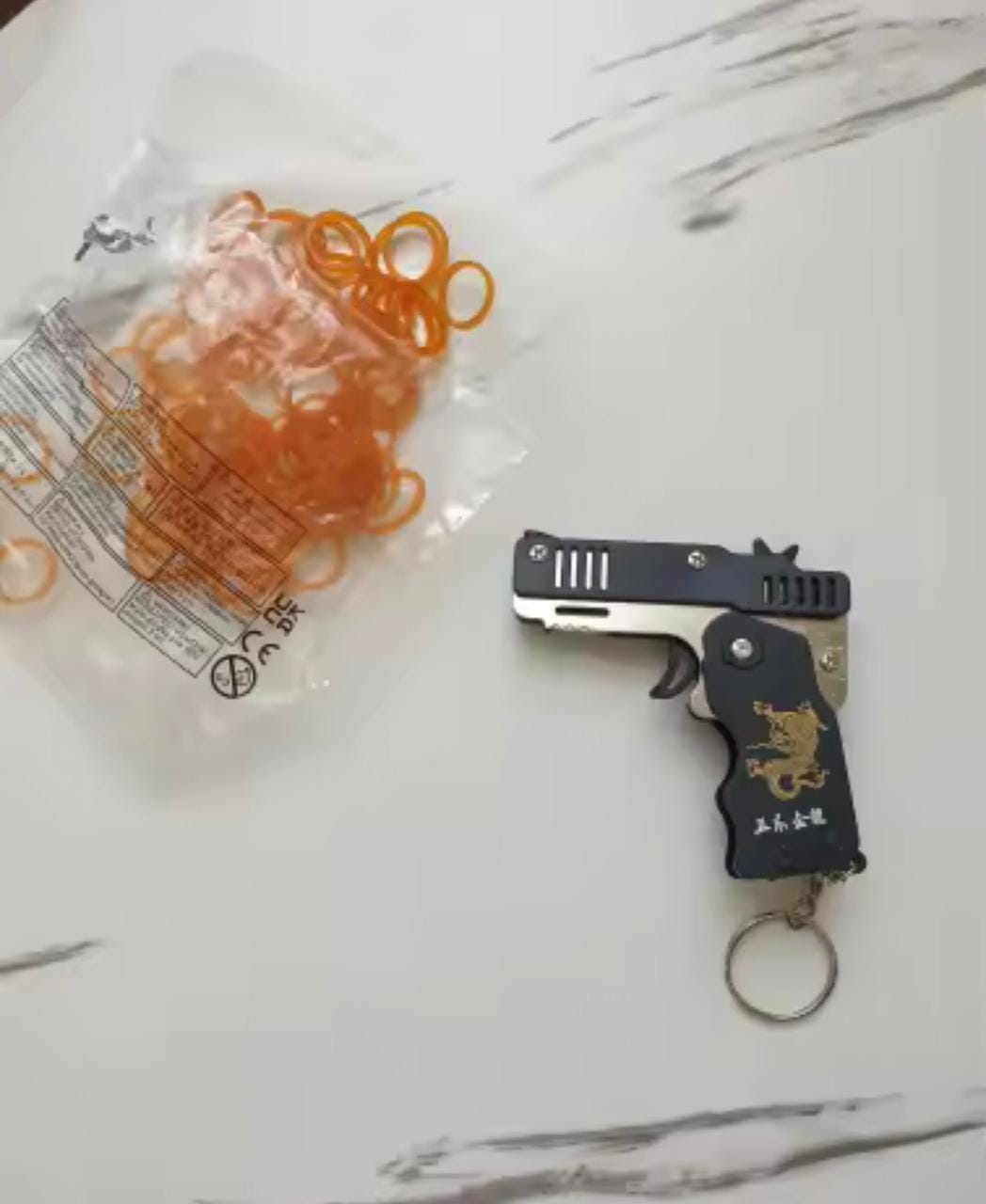 Customer photo review of Mini Pistola Lanza Ligas