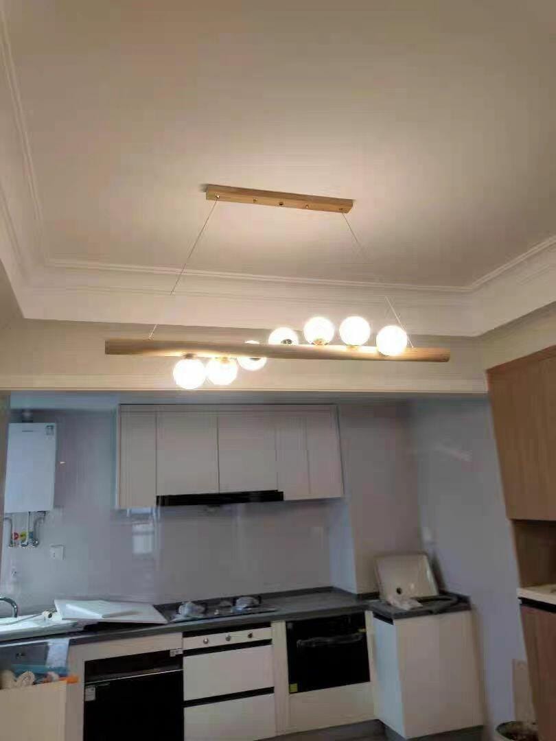 Customer photo review of Linear Wood Pendant Light, Walnut Bar, Opal Glass Globes, G9