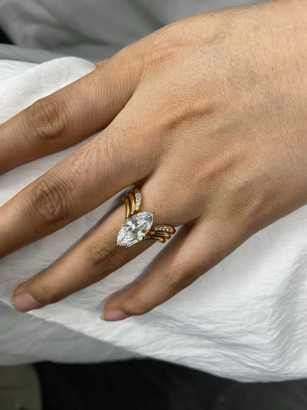 Customer photo review of S925 3PC Unique 3.0Ct Marquise Cut Engagement Ring with Open V-Shaped Pave Round Cut Accent Stones Wedding Band