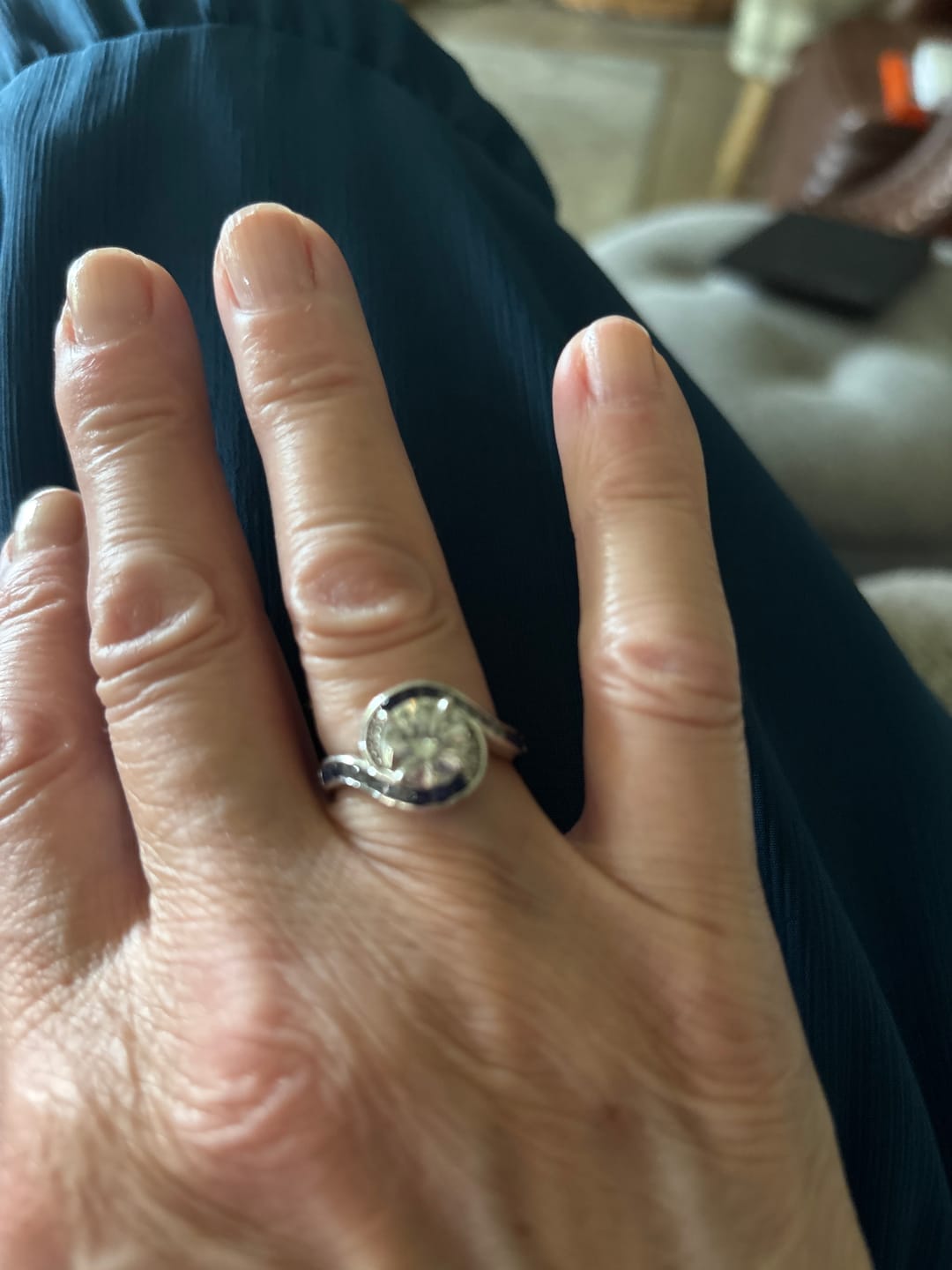 Customer photo review of Bypass Round Moissanite Gradient Ocean Blue Channel Set Engagement Ring