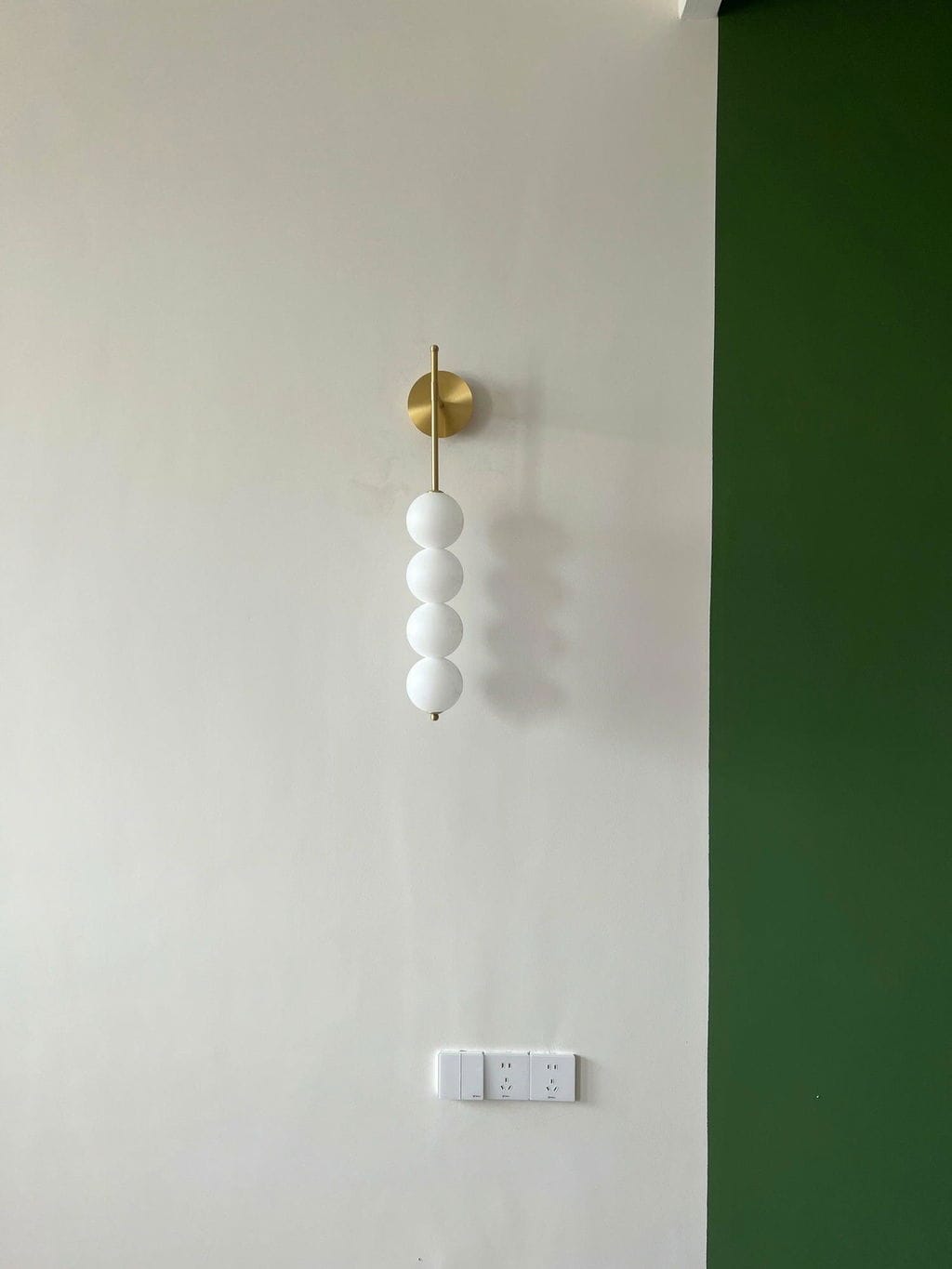 Customer photo review of Wall Lamp, Stacked Glass Globes, Matte White Shades, Integrated LED, Dimmable