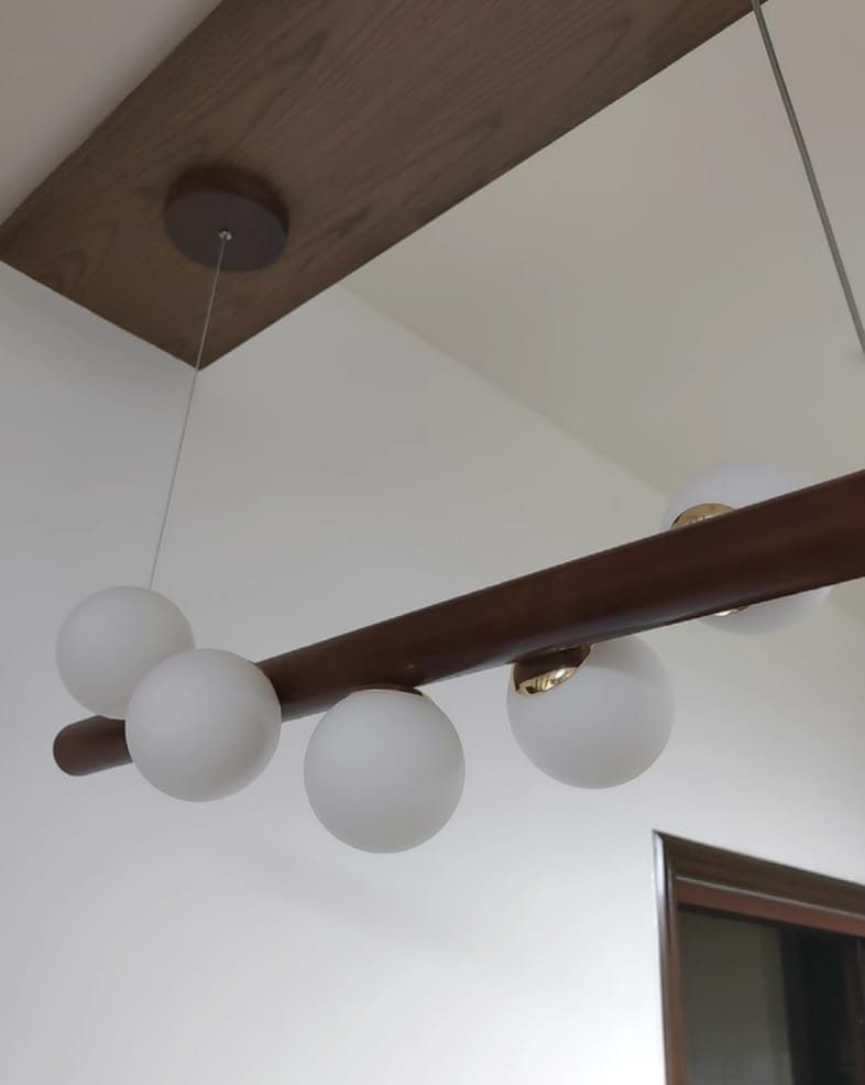 Customer photo review of Linear Wood Pendant Light, Walnut Bar, Opal Glass Globes, G9