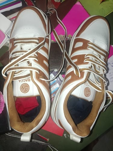 Customer's white and brown Bacca Bucci Metrolites sneakers viewed from above, featuring laces and brand logo.