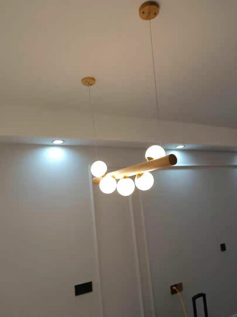 Customer photo review of Linear Wood Pendant Light, Walnut Bar, Opal Glass Globes, G9