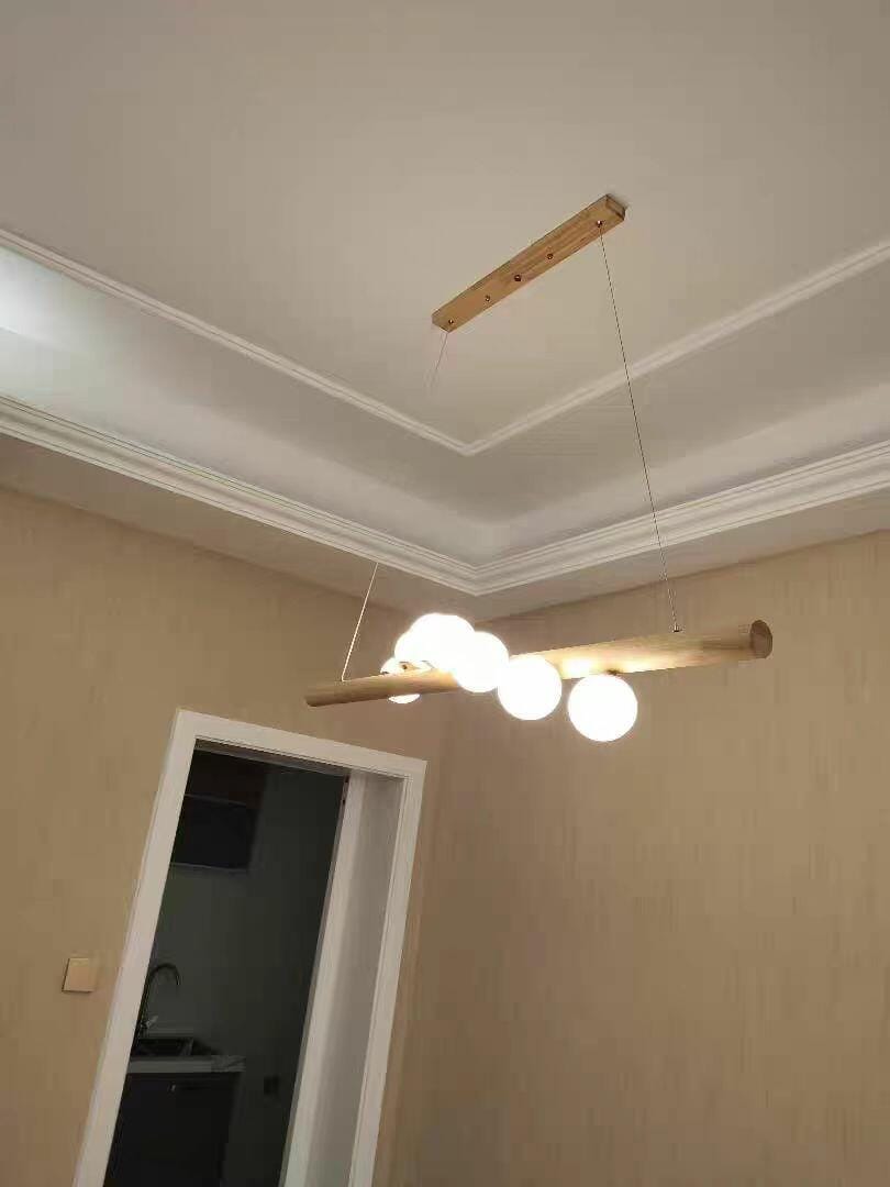 Customer photo review of Linear Wood Pendant Light, Walnut Bar, Opal Glass Globes, G9