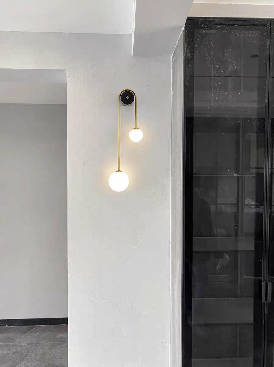 Customer photo review of Brass Arc Wall Light, Curved Arm, Two White Glass Shades, G9