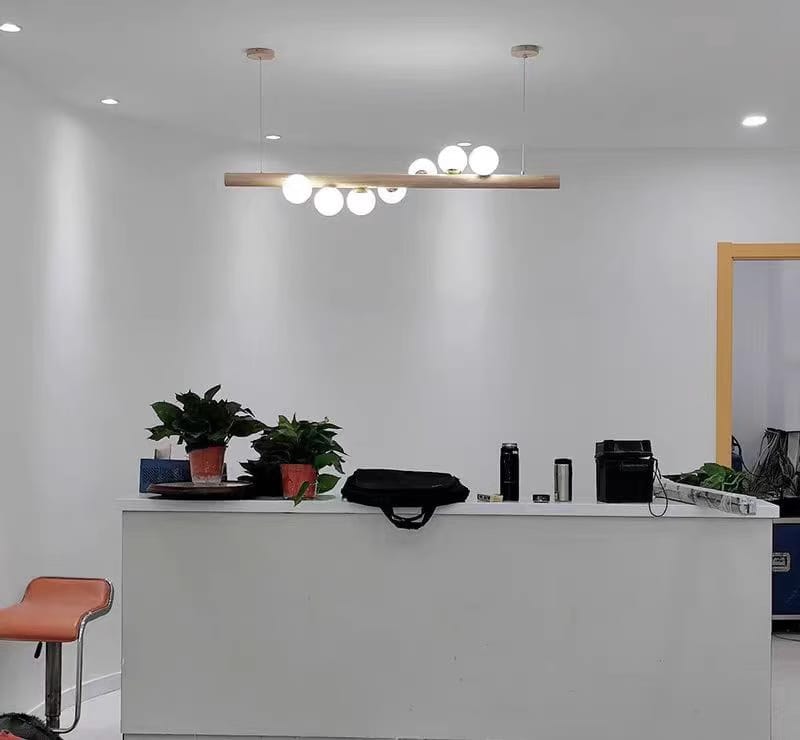 Customer photo review of Linear Wood Pendant Light, Walnut Bar, Opal Glass Globes, G9