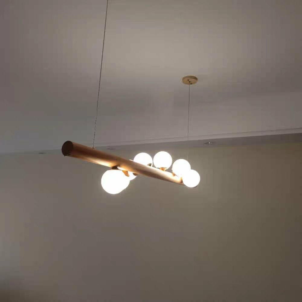Customer photo review of Linear Wood Pendant Light, Walnut Bar, Opal Glass Globes, G9
