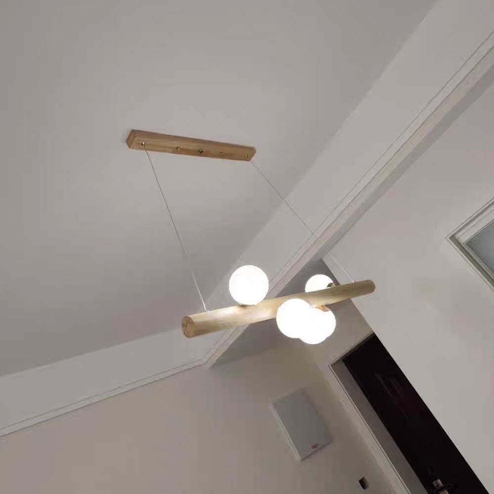 Customer photo review of Linear Wood Pendant Light, Walnut Bar, Opal Glass Globes, G9