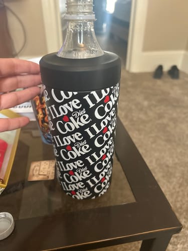 Customer's Diet Coke Universal XL stainless steel cup, held by hand, showing black and white patterned finish.